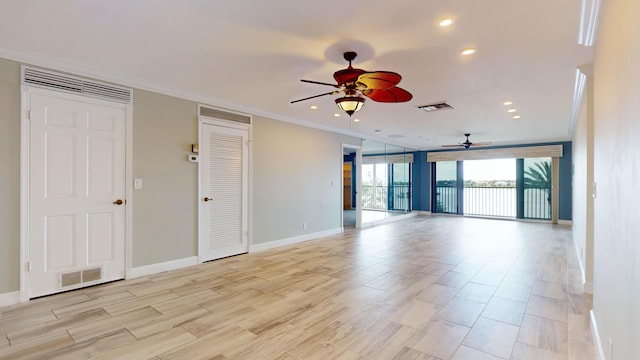 spare room featuring recessed lighting, baseboards, visible vents, and ornamental molding