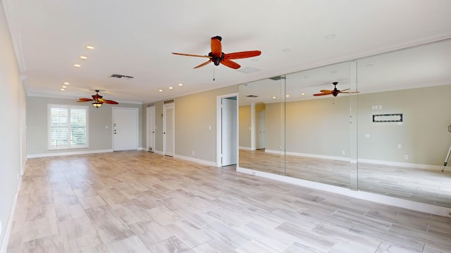 unfurnished room with crown molding, recessed lighting, visible vents, a ceiling fan, and baseboards