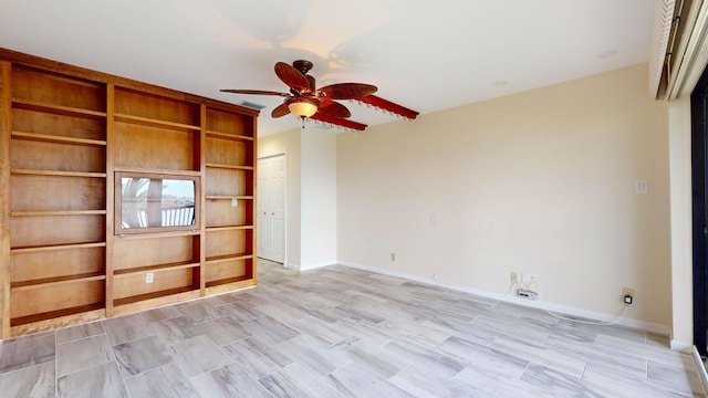 unfurnished living room with ceiling fan, visible vents, and baseboards