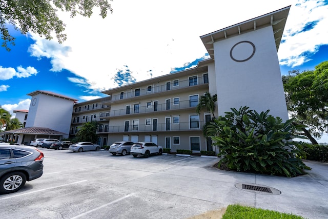 624 SW Saint Lucie Cres Unit 302, Stuart, FL 34994 - view of building exterior with uncovered parking