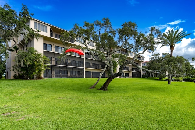 view of property's community with a yard