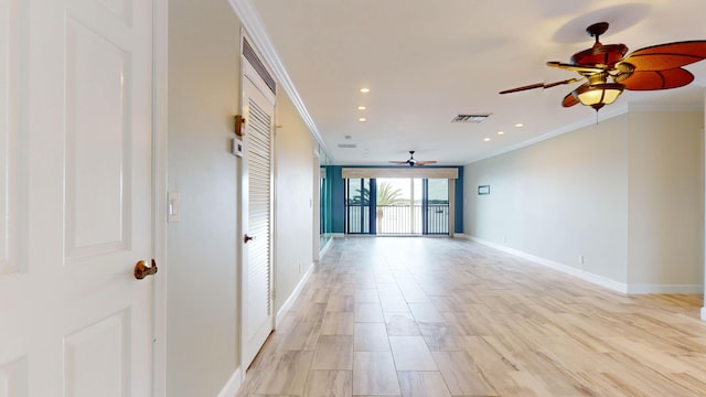 empty room with recessed lighting, visible vents, light wood-style flooring, ornamental molding, and baseboards