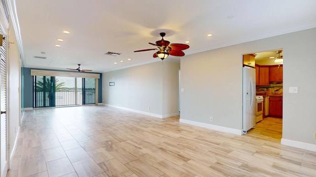 unfurnished room featuring recessed lighting, visible vents, baseboards, light wood-type flooring, and crown molding