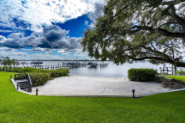 exterior space featuring a water view and a yard