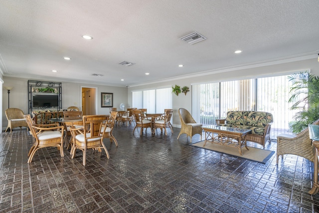 dining space with brick floor, crown molding, and recessed lighting