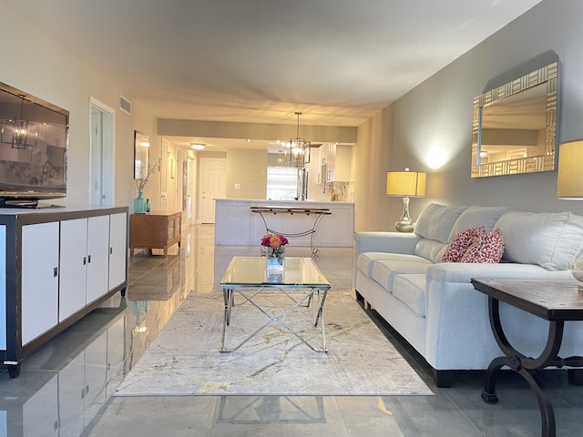 living area with a chandelier