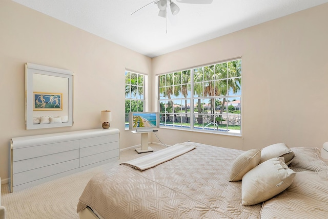 bedroom with ceiling fan and carpet flooring