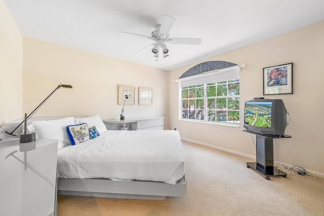 bedroom featuring light carpet and ceiling fan