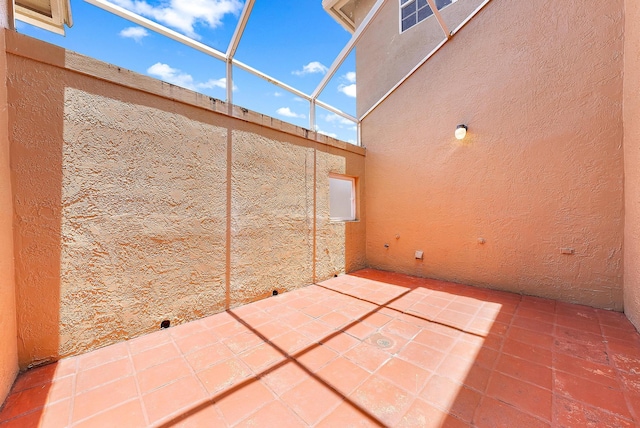 view of patio / terrace featuring a lanai