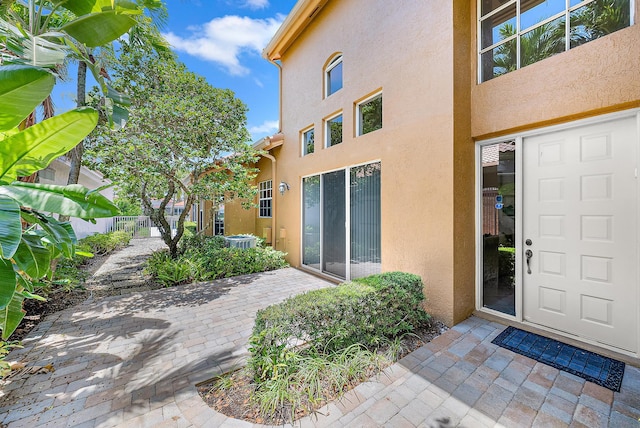 entrance to property with a patio