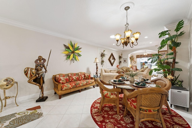 tiled dining room with ceiling fan with notable chandelier and ornamental molding