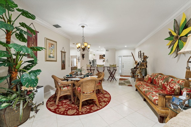 dining room featuring an inviting chandelier, ornamental molding, and light tile patterned flooring