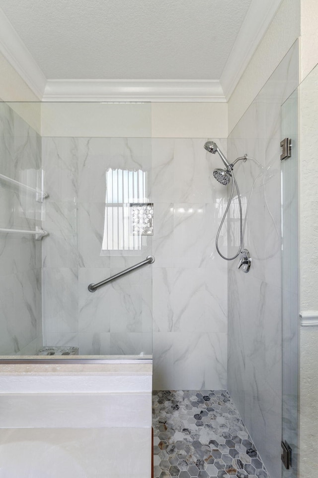 bathroom featuring tiled shower and ornamental molding