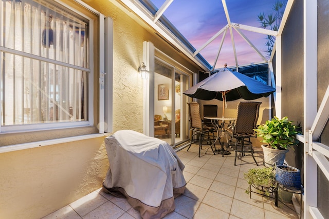 patio terrace at dusk with a lanai