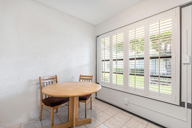 dining room featuring a wealth of natural light and light tile patterned floors