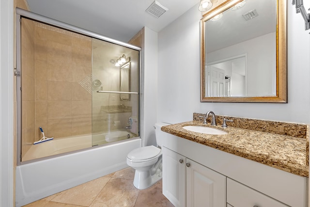 full bathroom featuring tile patterned floors, vanity, shower / bath combination with glass door, and toilet