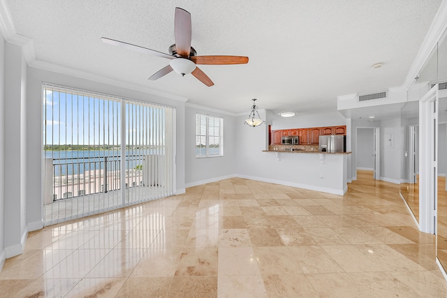 unfurnished living room with light tile patterned flooring, a water view, ceiling fan, and ornamental molding