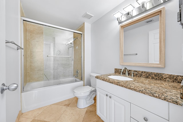 full bathroom with vanity, toilet, bath / shower combo with glass door, and tile patterned flooring