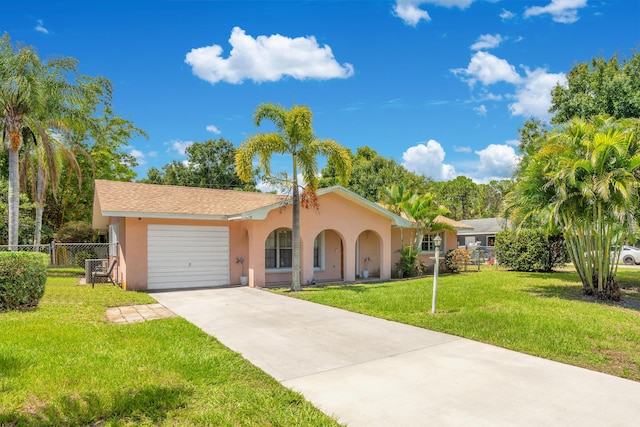 view of front facade featuring a garage and a front lawn