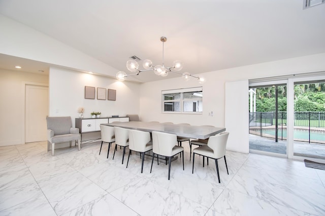 dining area featuring light tile patterned flooring, a chandelier, and lofted ceiling