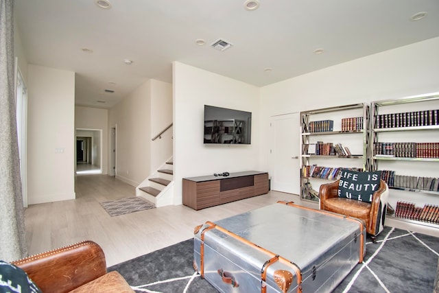 living room with light hardwood / wood-style floors