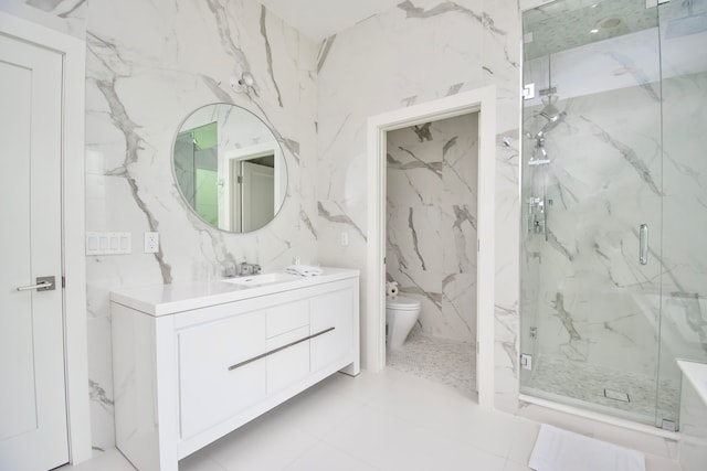 bathroom featuring a shower with shower door, tile patterned floors, vanity, tile walls, and toilet