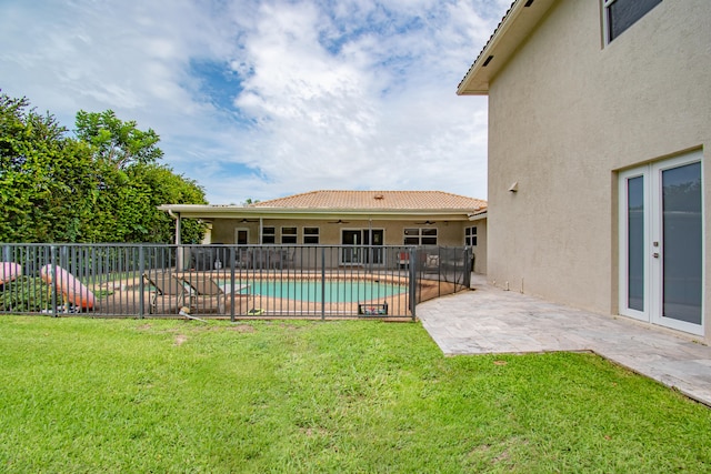 exterior space featuring a patio and a fenced in pool