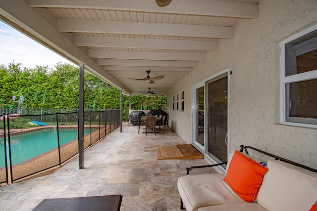 view of patio featuring ceiling fan, an outdoor hangout area, and a fenced in pool