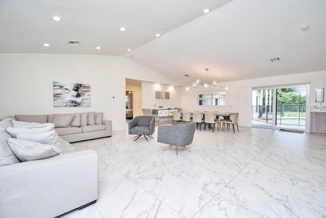 tiled living room with lofted ceiling and a chandelier