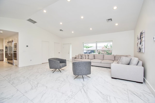 tiled living room featuring lofted ceiling