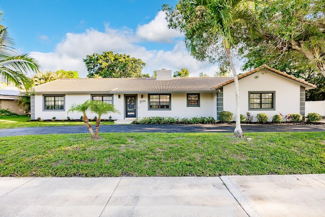 ranch-style home with a front yard