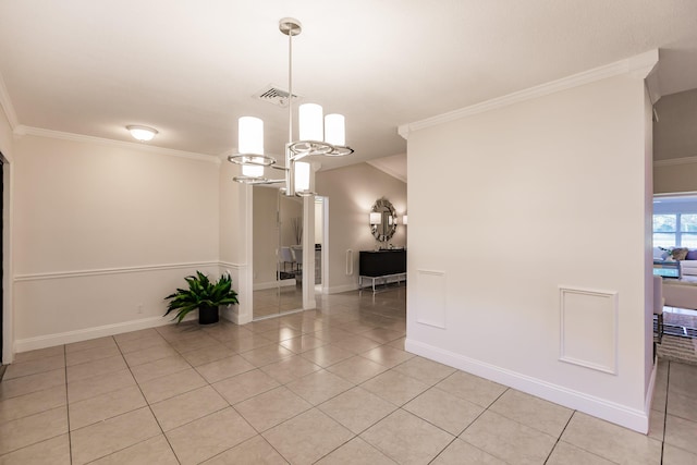 tiled empty room featuring crown molding and a notable chandelier