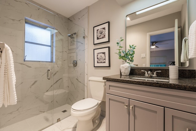 bathroom with ceiling fan, toilet, vanity, and walk in shower