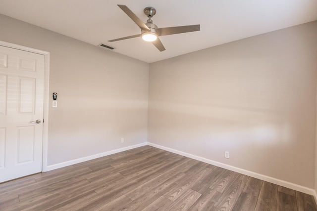 empty room featuring ceiling fan and wood-type flooring