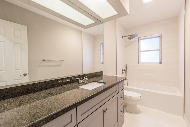 full bathroom featuring tile patterned floors, vanity, toilet, and tiled shower / bath