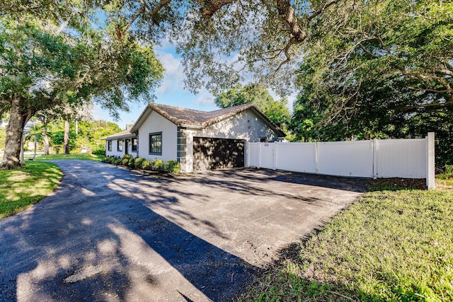 view of side of property featuring a garage