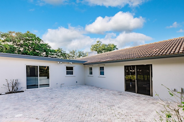 rear view of property with a patio area