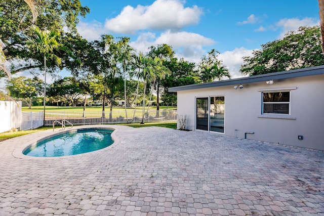 view of swimming pool with a patio area