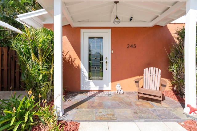 property entrance featuring a patio