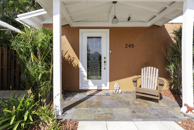 doorway to property featuring a patio