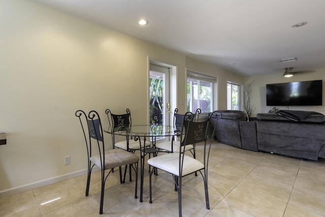 dining space featuring light tile patterned floors