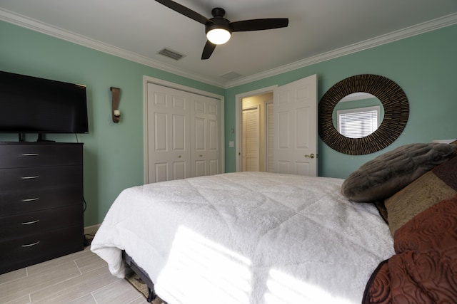 bedroom with ceiling fan and ornamental molding