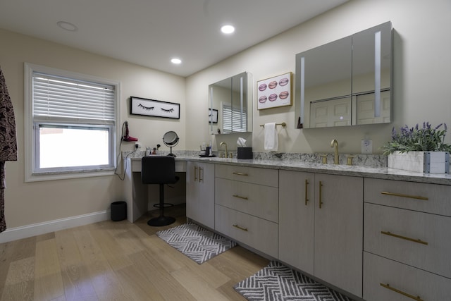 bathroom with hardwood / wood-style floors and vanity