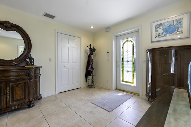 foyer with light tile patterned floors