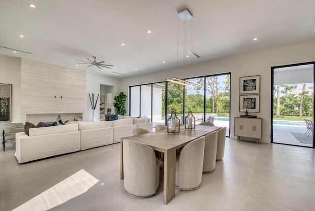 tiled dining area with ceiling fan