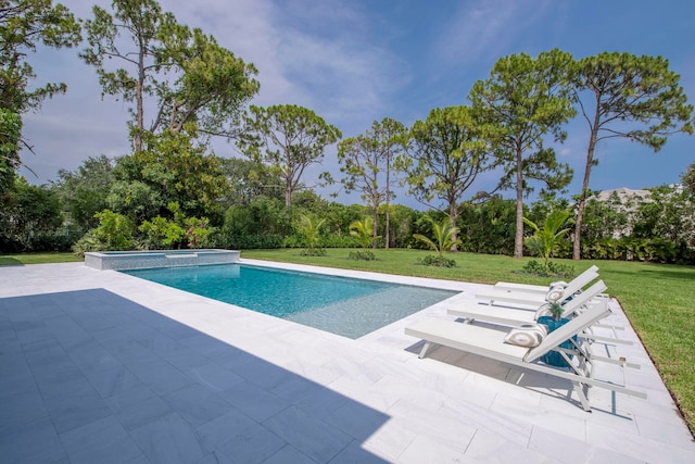 view of swimming pool with a patio and a yard