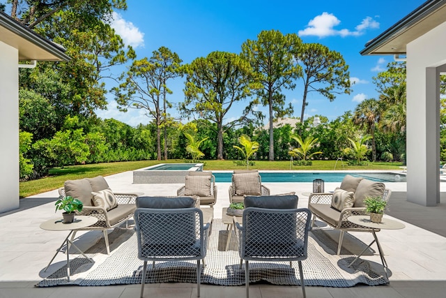 view of patio featuring an outdoor hangout area and a swimming pool with hot tub