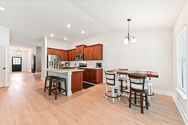 kitchen featuring plenty of natural light, light wood-type flooring, and appliances with stainless steel finishes