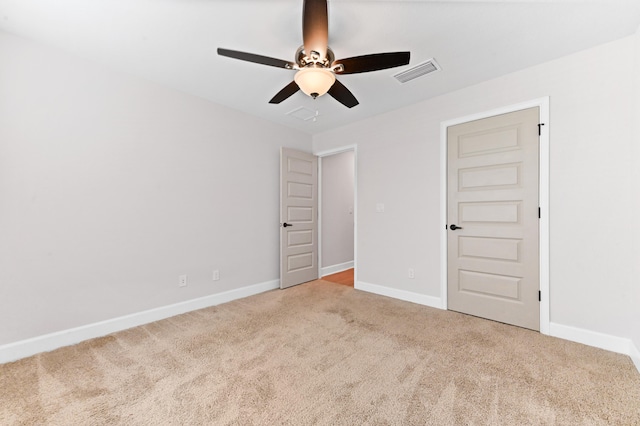 carpeted empty room with ceiling fan