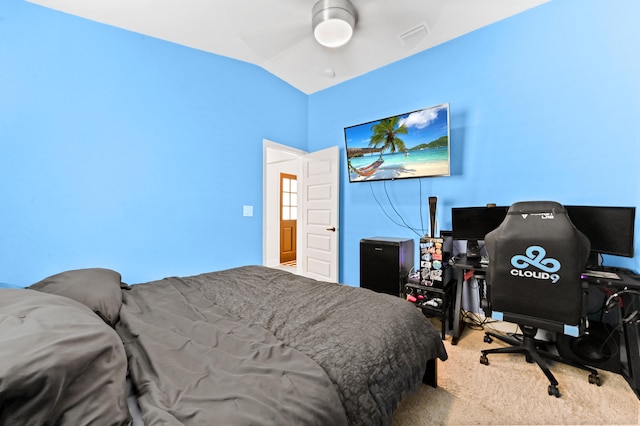 carpeted bedroom featuring ceiling fan and lofted ceiling